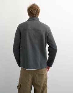 Model wearing Classic fit funnel neck sweatshirt in charcoal