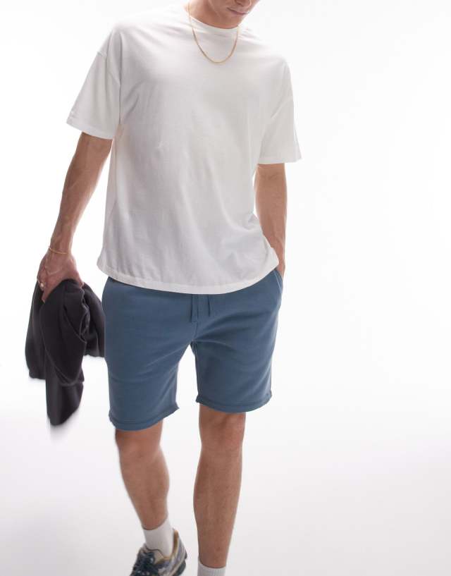 Topman - classic fit jersey short with raw hem in blue