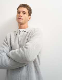 Model wearing Classic fit knitted polo in grey