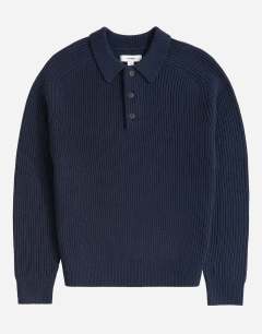 Model wearing Classic fit knitted polo in navy