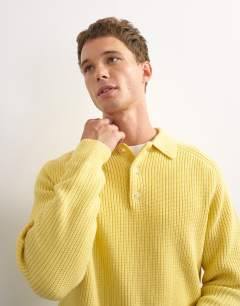 Model wearing Classic fit knitted polo in yellow