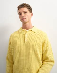 Model wearing Classic fit knitted polo in yellow