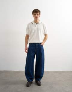 Model wearing Classic fit knitted rib polo with tipping in ecru