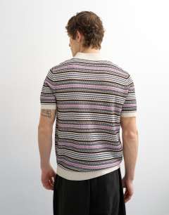 Model wearing Classic fit knitted stripe polo in cream