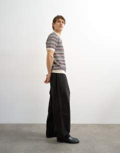 Model wearing Classic fit knitted stripe polo in cream