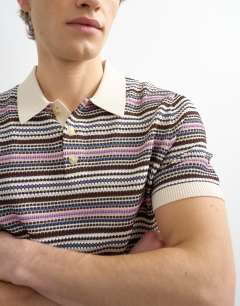 Model wearing Classic fit knitted stripe polo in cream