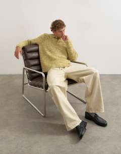 Model wearing Classic fit knitted twist polo in light green