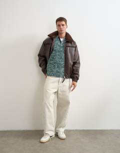 Model wearing Classic fit knitted twist polo in teal