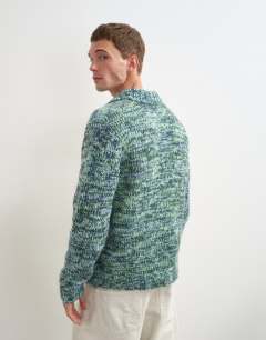Model wearing Classic fit knitted twist polo in teal