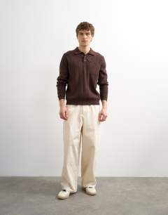 Model wearing Classic fit long sleeve pointelle knitted polo in brown