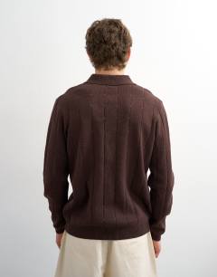 Model wearing Classic fit long sleeve pointelle knitted polo in brown