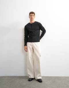 Model wearing Classic fit long sleeve rib henley t-shirt in black