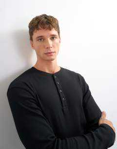 Model wearing Classic fit long sleeve rib henley t-shirt in black