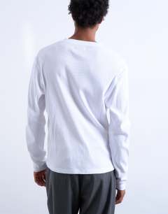Model wearing Classic fit long sleeve rib henley t-shirt in white