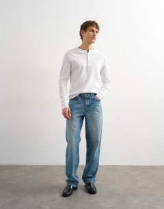 Model wearing Classic fit long sleeve rib henley t-shirt in white