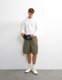 Model wearing Classic fit long sleeve rib henley t-shirt in white