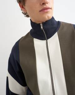 Model wearing Classic fit paneled pique track top in navy