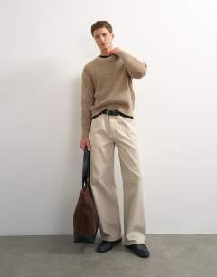 Model wearing Classic fit plaited fisherman knit jumper in oatmeal