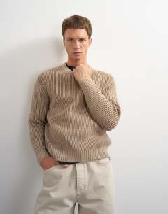 Model wearing Classic fit plaited fisherman knit jumper in oatmeal