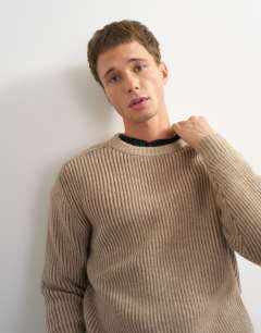 Model wearing Classic fit plaited fisherman knit jumper in oatmeal