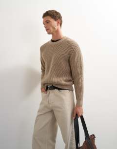 Model wearing Classic fit plaited fisherman knit jumper in oatmeal