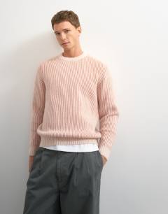 Model wearing Classic fit plaited fisherman knit jumper in pink