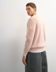 Model wearing Classic fit plaited fisherman knit jumper in pink