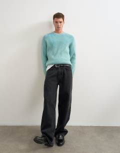 Model wearing Classic fit plaited fisherman knit jumper in teal