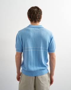 Model wearing Classic fit pointelle knitted polo in light blue