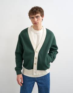 Model wearing Classic fit retro cardigan in dark green