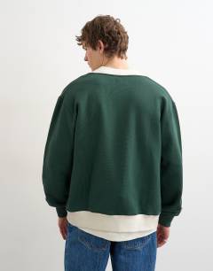 Model wearing Classic fit retro cardigan in dark green