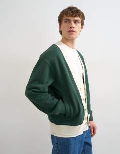 Model wearing Classic fit retro cardigan in dark green
