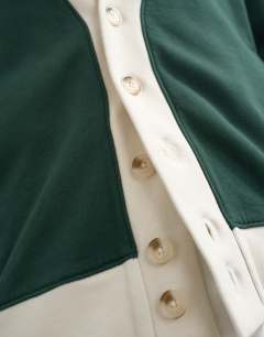 Model wearing Classic fit retro cardigan in dark green