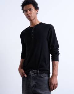 Model wearing Classic fit rib long sleeve henley t-shirt in black