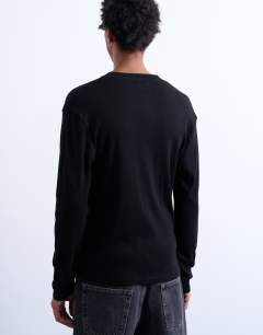 Model wearing Classic fit rib long sleeve henley t-shirt in black