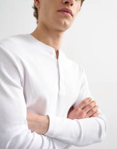 Model wearing Classic fit rib long sleeve henley t-shirt in white