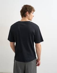 Model wearing Classic fit ribbed henley t-shirt in black