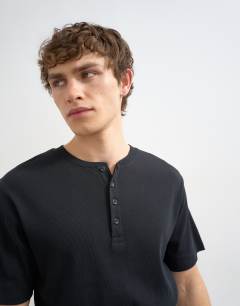 Model wearing Classic fit ribbed henley t-shirt in black
