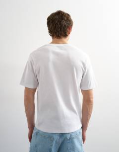 Model wearing Classic fit ribbed henley t-shirt in white