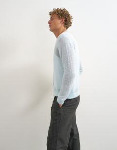 Model wearing Classic fit sheer knit cardigan in light blue