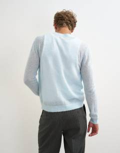 Model wearing Classic fit sheer knit cardigan in light blue