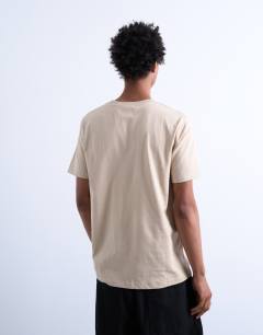 Model wearing Classic fit t-shirt in stone