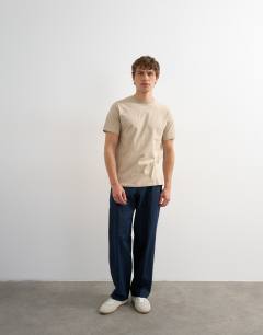 Model wearing Classic fit t-shirt in stone