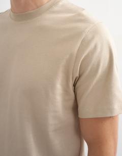 Model wearing Classic fit t-shirt in stone