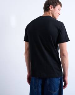 Model wearing Classic fit t-shirt with Je t'aime embroidery in black
