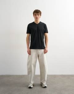 Model wearing Classic fit v neck t-shirt in black