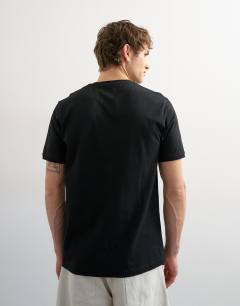 Model wearing Classic fit v neck t-shirt in black