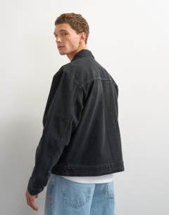 Model wearing Classic fit western denim jacket in washed black