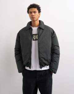 Model wearing Collared puffer jacket in black