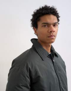 Model wearing Collared puffer jacket in black